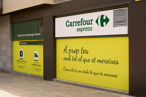 Viladecans, Spain - September 13, 2023: Carrefour Express promotional outdoor sign with name, logo and phrases.