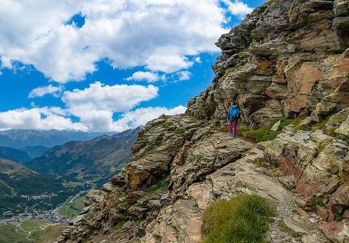 Breuil-Cervinia, Italy - 30 August 2023 - A view of Cervinia mountain town with Cervino mount peak of Alps, trekking paths and Lago Blu touristic lake. In Valle d'Aosta region, north Italy. Here in particular a view of Cervinia from altitude