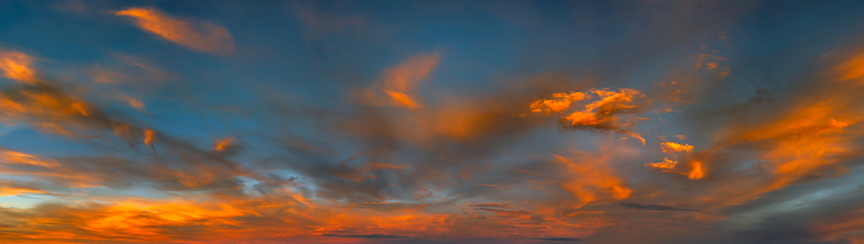 Panorama vivid sky.Panorama of a twilight sunset and colorful clouds - sunlight with dramatic cloud.Panoramic Evening Orange dark sky.