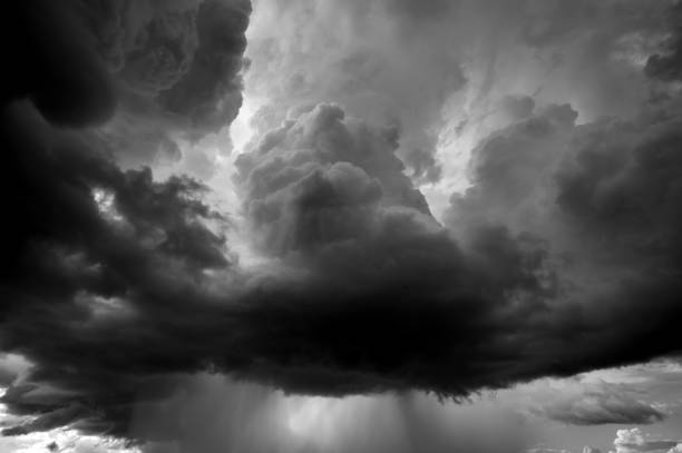 Dark sky and dramatic black cloud before rain.A tropical cyclone is a rapidly rotating storm system characterized by a low-pressure center, a closed low-level atmospheric circulation, strong winds.