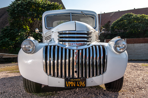 Old pickup stylishly converted to hot rod in white with 350 cui engine