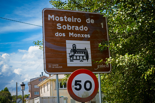 Sobrado dos Monxes, Spain, September 9th 2023: View on road sign indicating the Monastery of Sobrado dos Monxes