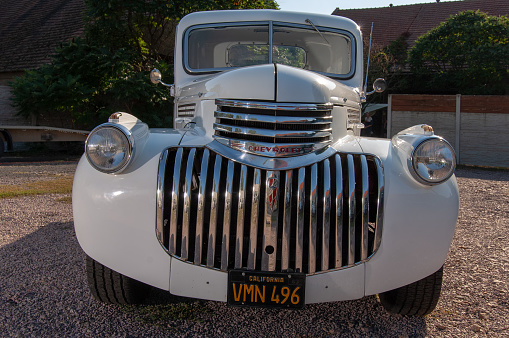 Old pickup stylishly converted to hot rod in white with 350 cui engine