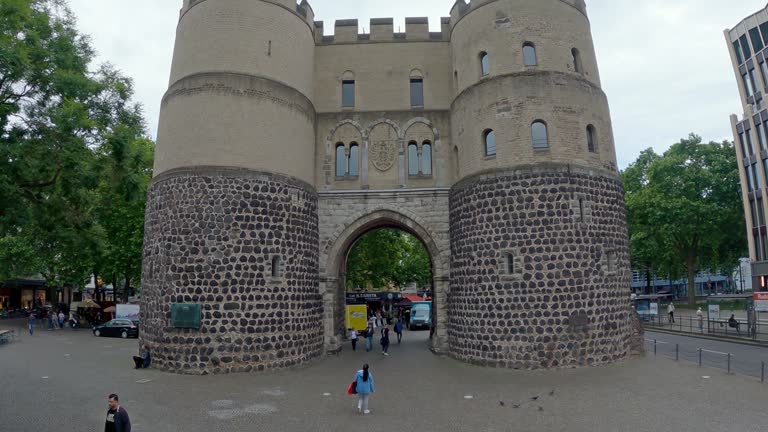 Aerial shot of Hahnen Gate on Rudolf Platz square in Cologne, Germany, slow motion