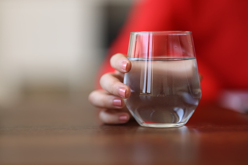 Businesswoman and a glass of water