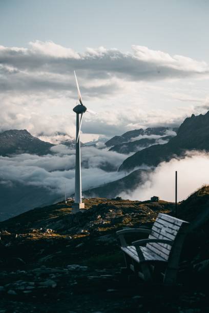 istock Wind turbine in the Swiss Alps over clouds. 1677953543