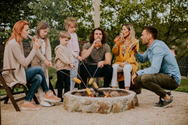 istock Friends having good time and baking corns in the house backyard 1677954731