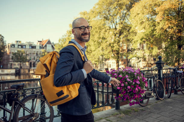 istock Handsome elegant single gay male 50s working man in Amsterdam 1677961220