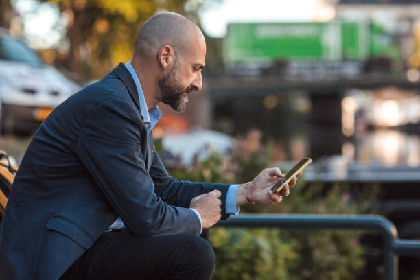 istock Handsome elegant single gay male 50s working man in Amsterdam 1677963529
