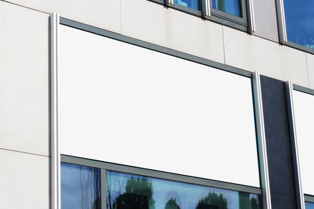 istock Large billboard banner on a storefront mock-up template, blank white restaurant or shop sign mockup. 1677966238