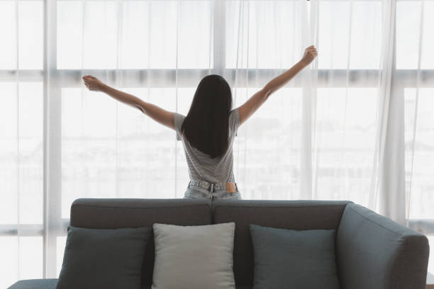 istock Asian woman relax on sofa at home 1677966815
