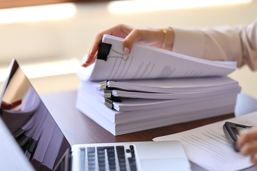 Woman hand searching work document