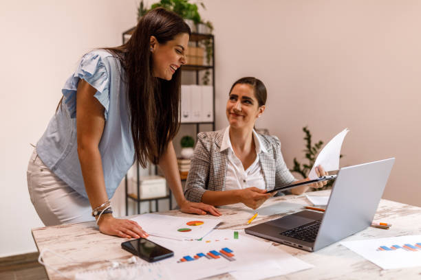 istock Two young businesswomen co-working on a mutual project 1677970621