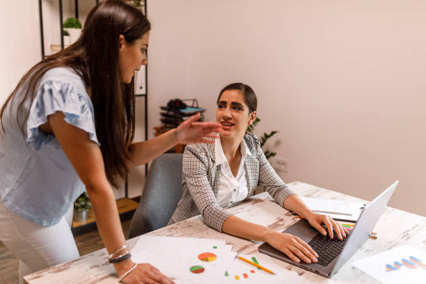 istock Two young businesswomen co-working on a mutual project 1677970626