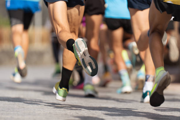 istock Marathon runners running on city road 1677976050