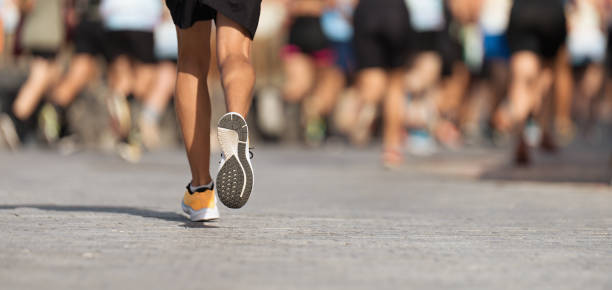 istock Marathon runners running on city road 1677976619