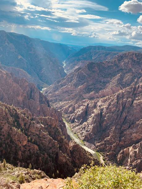 istock Stream Flowing through a Narrow Valley Canyon 1677988497