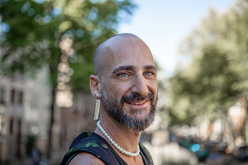 Handsome casual single gay male 50s tourist man in Amsterdam