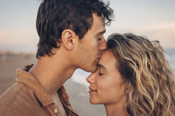 istock Man kissing his woman 1678002518