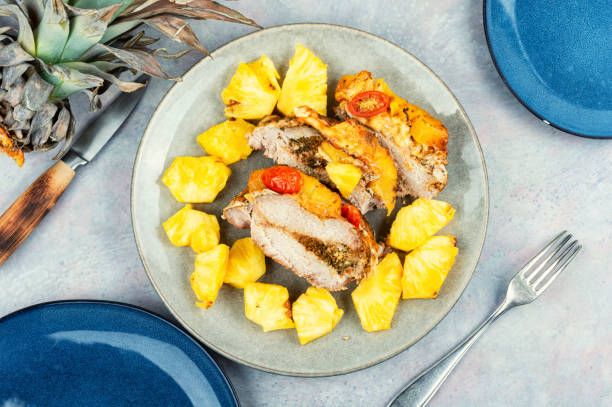 istock Pork meat baked with pineapple. 1678024875