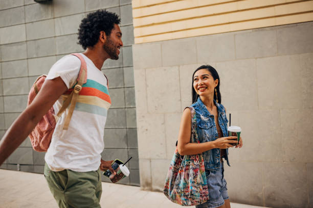 istock Two best friends drinking coffee from a disposable cup while walking around the city and enjoying an active lifestyle 1678029599