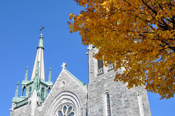 istock Church steeple and blue sky in autumn 1678037652