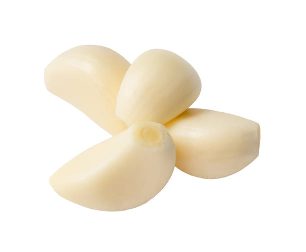 istock Top view peeled garlic cloves in stack isolated on white background with clipping path Close up photo 1678050300