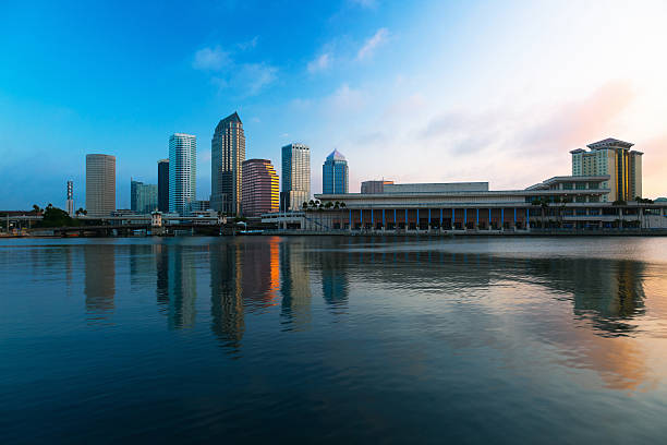 Tampa, Florida. Downtown district of American city after sunset with brightly illuminated high buildings and street traffic. USA travel destination.