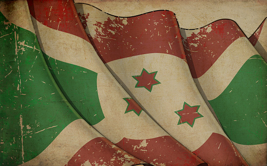 Background illustration of an old paper with a print of a waving Flag of Burundi