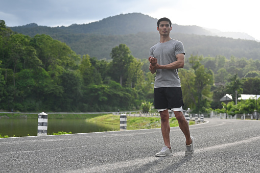 Portrait of Young Athlete man standing with confident during do jogging or running.