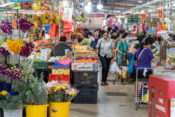 Scenic view of the wet market in Singapore, people can seen buying the vegetables and grocery around it. stock photo