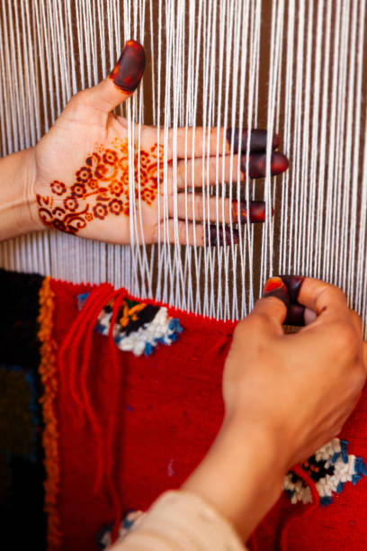 istock Berber woman weaving textiles, Ouarzazate, Morocco 1678114105