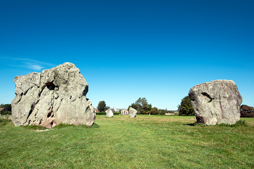 Avebury Henge, Wiltshire, England, UK. This free-to-enter ancient stone circle site dates from Neolithic times and its purpose is debatable. It is constructed from a large outer circle of stones with two smaller inner circles, all surrounded by earthworks and a ditch. Abandoned by the Iron Age it nevertheless remains a significant Henge in the landscape of ancient Wiltshire, England