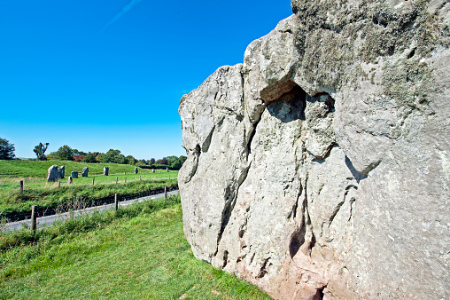 Avebury Henge, Wiltshire, England, UK. This free-to-enter ancient stone circle site dates from Neolithic times and its purpose is debatable. It is constructed from a large outer circle of stones with two smaller inner circles, all surrounded by earthworks and a ditch. Abandoned by the Iron Age it nevertheless remains a significant Henge in the landscape of ancient Wiltshire, England