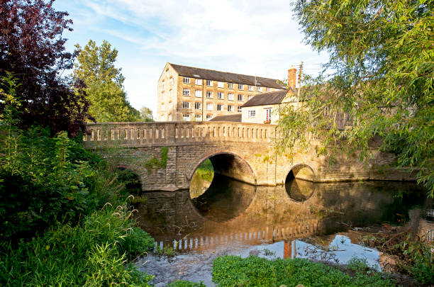 istock Millstream and arched bridge, Malmesbury, Wiltshire, England, UK 1678123899