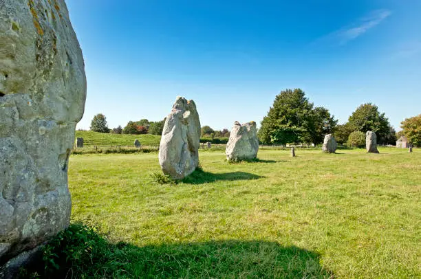 Avebury Henge, Wiltshire, England, UK. This free-to-enter ancient stone circle site dates from Neolithic times and its purpose is debatable. It is constructed from a large outer circle of stones with two smaller inner circles, all surrounded by earthworks and a ditch. Abandoned by the Iron Age it nevertheless remains a significant Henge in the landscape of ancient Wiltshire, England