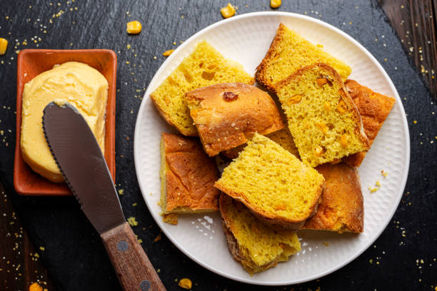 istock Homemade cornbread slices on white dish and butter flat lay view 1678151949
