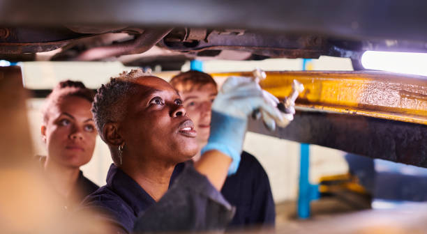 istock female auto mechanic tutor with students 1678160135
