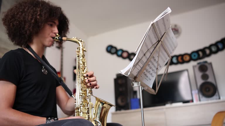 Young boy play saxophone