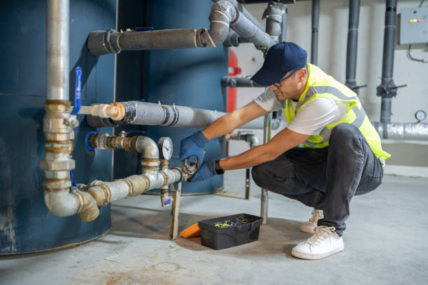 Male Engineer Checking Boiler System In A Basement Technician Repairing Heating System Pipes In The Boiler Room piping hot stock pictures, royalty-free photos & images