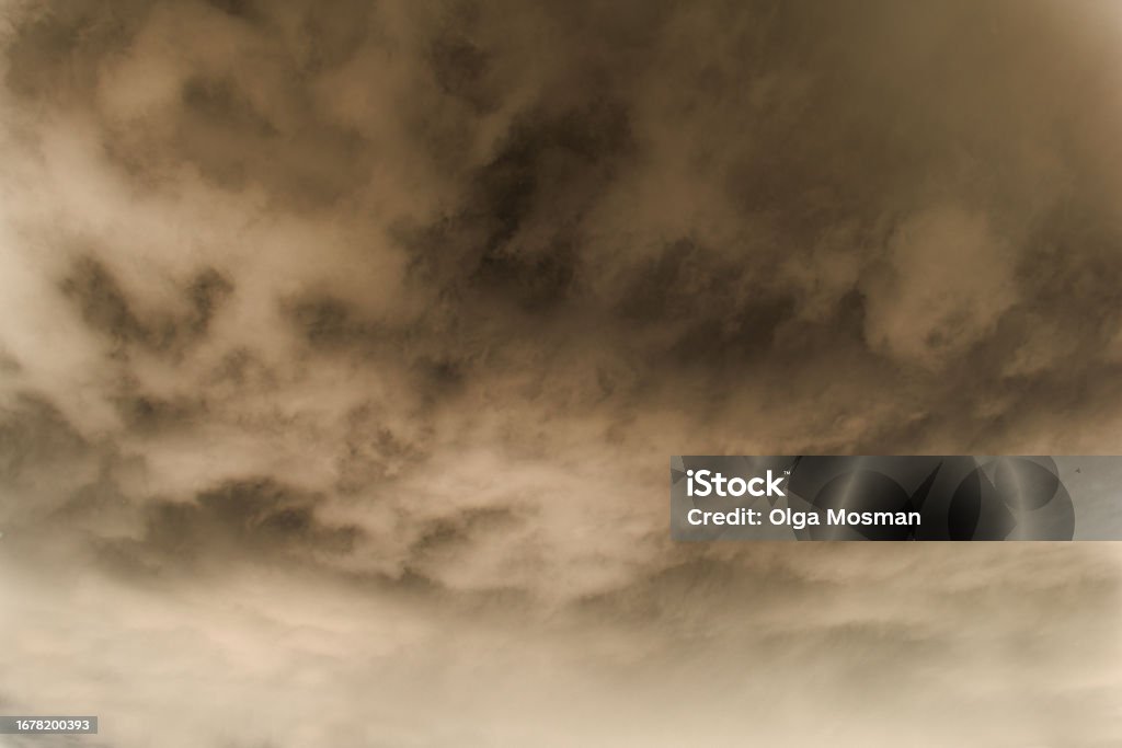 dark clouds, smog, smoke, smoke from explosions in the sky, tornado, hurricane or thunderstorm, sometimes heavy clouds but no rain,Dust storm due to dynamite blast on the construction site Abstract Stock Photo