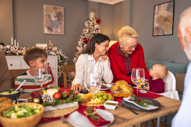 istock Happy multi-generation family gathered at home for Christmas dinner 1678201028