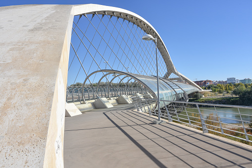 Zaragoza, Spain - 23 Oct, 2021: The Third Millenium Bridge (Puente del Tercer Milenio), crosses the Ebro River in Zaragoza, Aragon