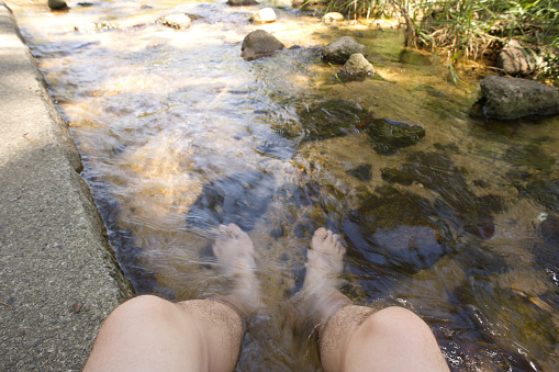 feet standing on the beach