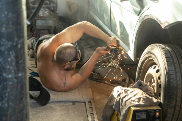 istock The mechanic uses a welding machine to repair a car threshold. 1678264783