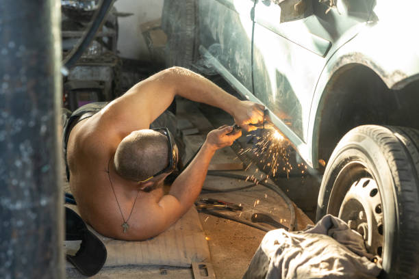 istock The mechanic uses a welding machine to repair a car threshold. 1678264785