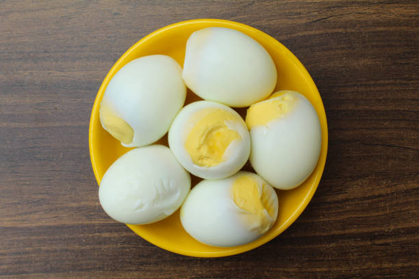 istock Boiled chicken eggs in a plate close-up view 1678267537
