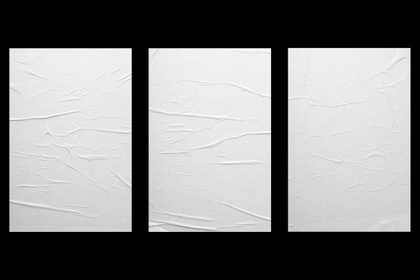istock Three sheets of paper with folds isolated on a black background. 1678284156