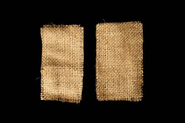 istock Two pieces of burlap isolated on a black background. 1678284180