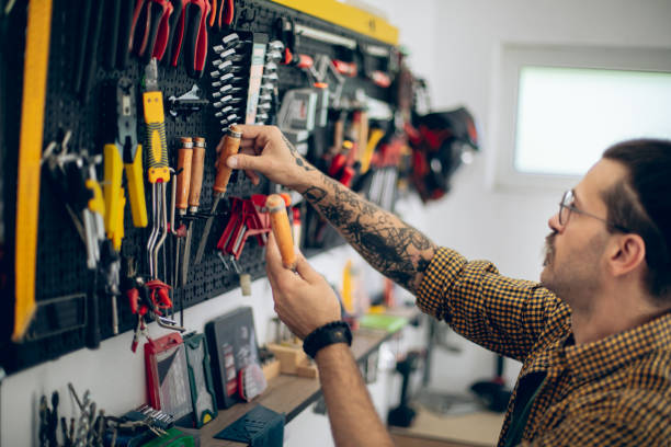 istock Craftsman taking his work tools of of wall organizer 1678304405